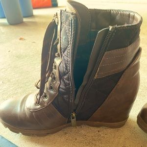 Wedge boots. Zip up side and faux lace up.
